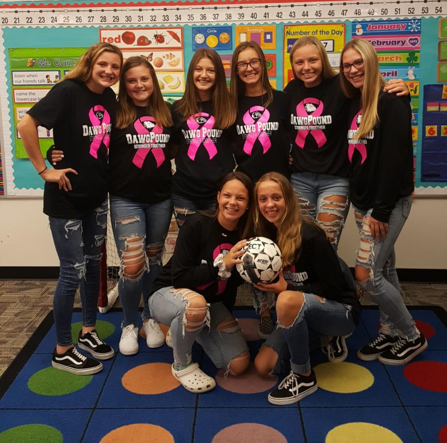 Eighth-grade girls soccer team together in a kindergarten classroom. 