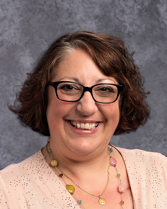 Mrs.Davids+smiling+for+her+yearbook+photo+for+2019-2020.+Always+staying+positive.