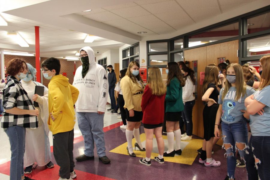 Seventh and eighth graders lined up outside the library on Thursday waiting for their picture to be taken. 
