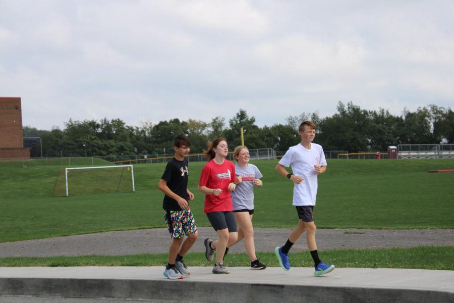 Cross country team going for a run on a beautiful day
