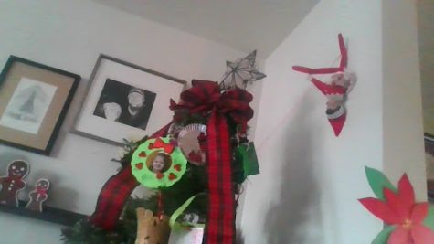 Elf ziplining on Christmas tree last year