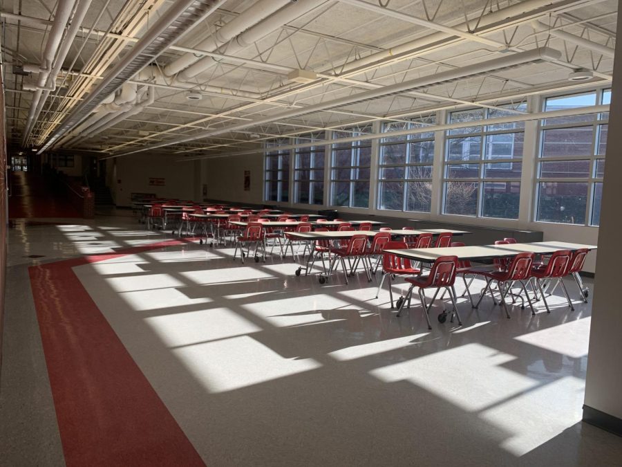 In+the+lunchroom+on+March+24the+cafeteria+sits+without+plexiglass+to+distance+students.+%0A