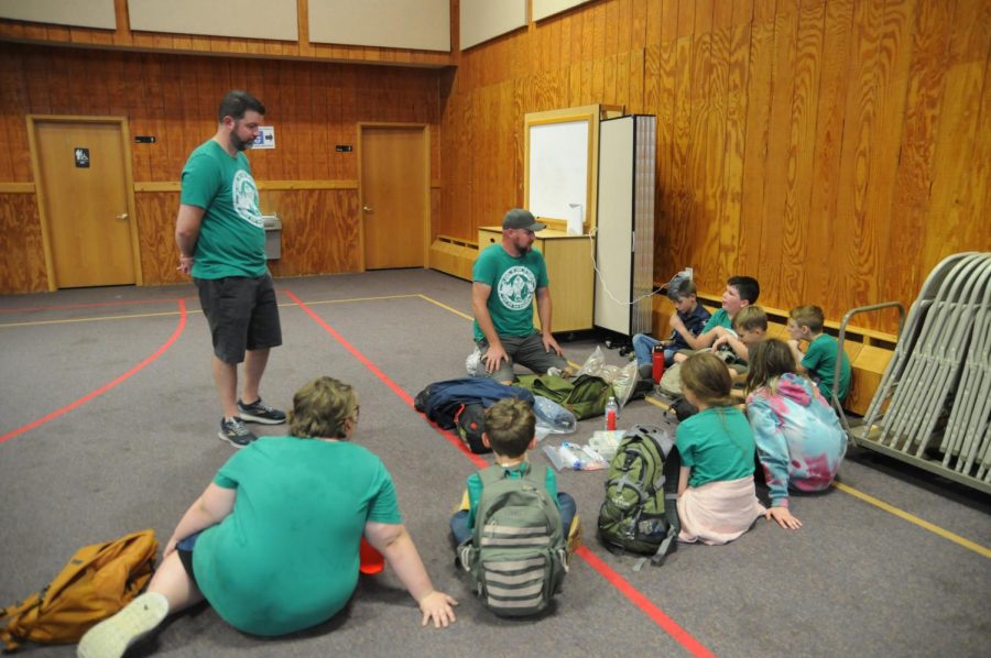 Mr. David Kaufman and Mr. Tom Brien, den leaders, teach Webelos and Arrow of Light scouts about how to pack a day pack during the Pack 444  pack meeting at Unionville United Methodist Church on Wed., Sept. 31.