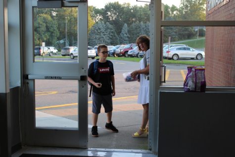 Mrs. Boyd greets students as they arrive at school each morning.  