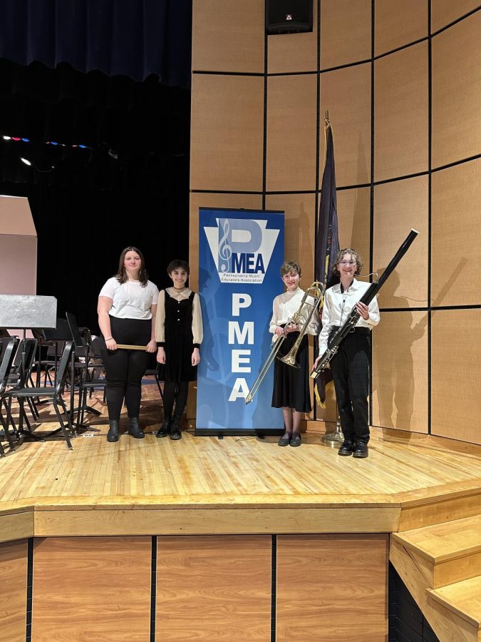 The+eighth+graders+who+participated+in+the+PMEA+District+Band+Concert.+Reading+from+left+to+right%3A+Makalea+Jordan%2C+Stella+Haney%2C+Elizabeth+Mooney%2C+and+Audrey+Mooney.+%0A