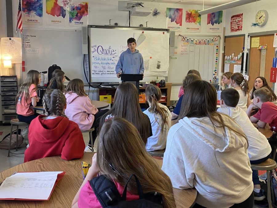 Christopher Denkovich, member of the FHS Press, teaches Bulldog Barker Members about the New Voices bill on the April 4th team meeting. 