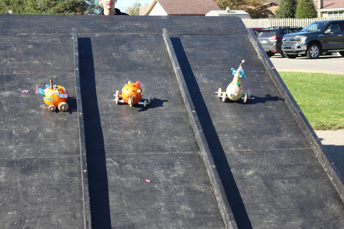  Pumpkin cars D, E, and F racing down the ramp on Friday, Nov. 3.
