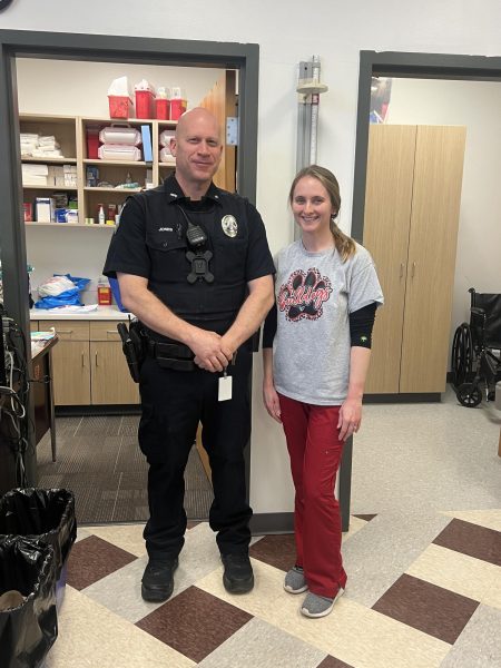 Officer Jones and Mrs. Elizabeth Scobie pose for a picture on Monday, March 19, in the nurse’s office to show their hard work.