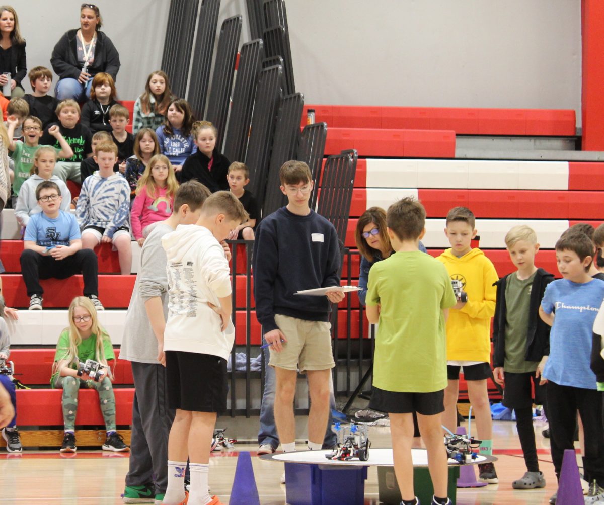  Grade 3 students watch as contestants battle in the gymnasium on April 11.
