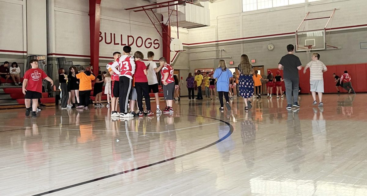 Students running around during the school dance.