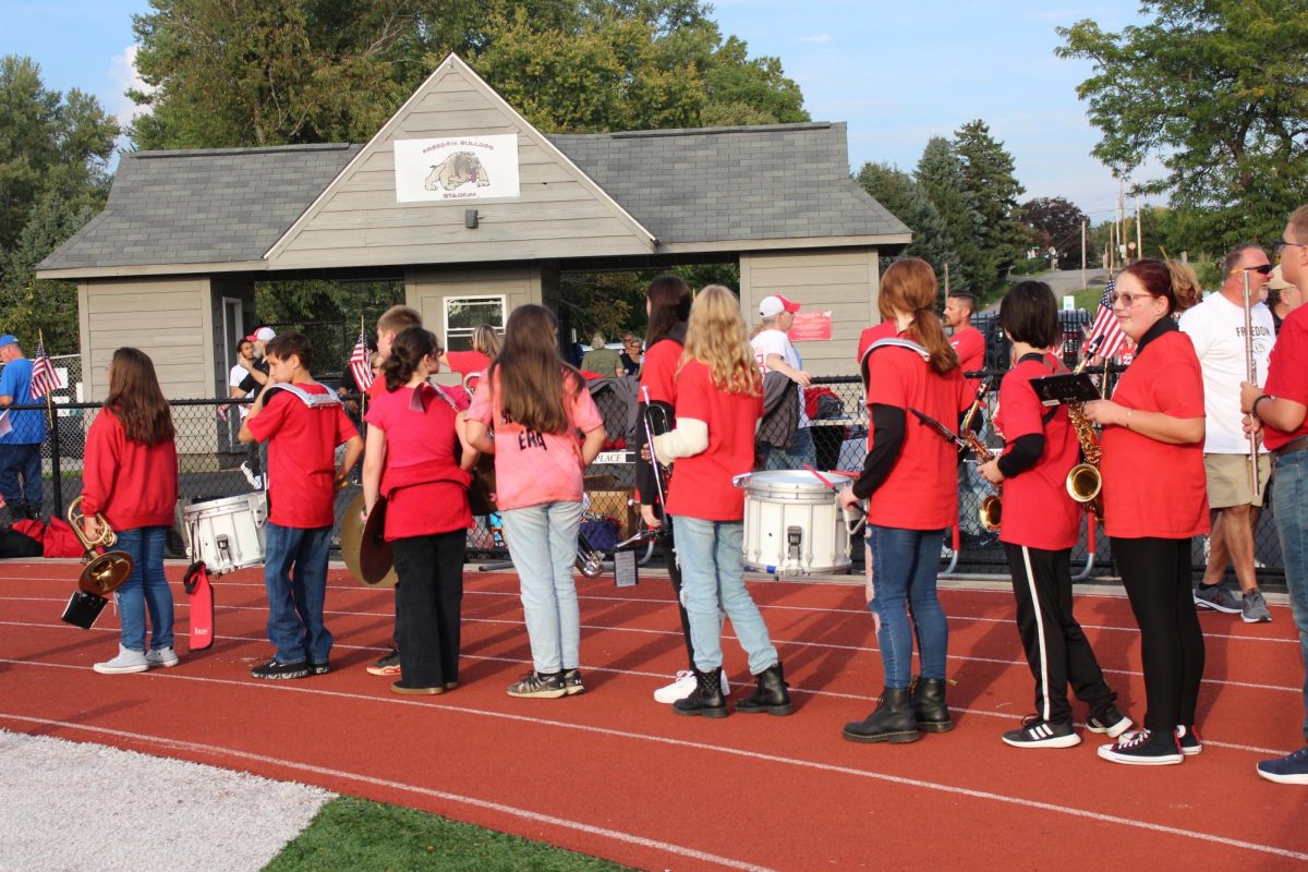 On Sep. 20, middle schoolers line up with their instruments to go onto the football field for middle school band night.
