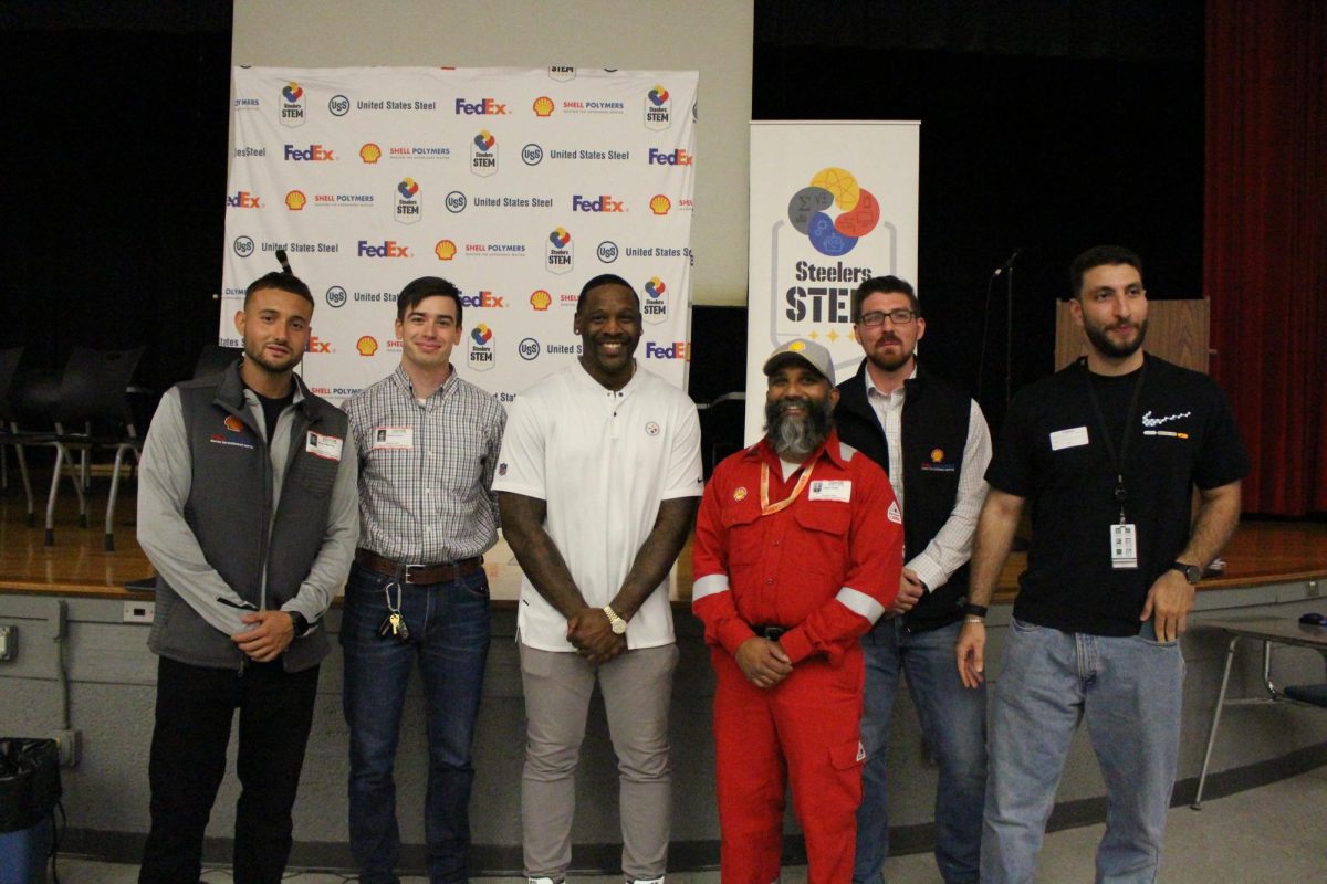 The Shell workers and Arthur Moats lined up for a photo after the presentation.