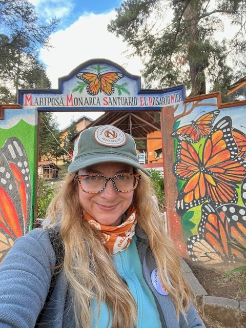 Ms. Jeanine Ging standing in front of El Rosario Butterfly Sanctuary in Mexico.