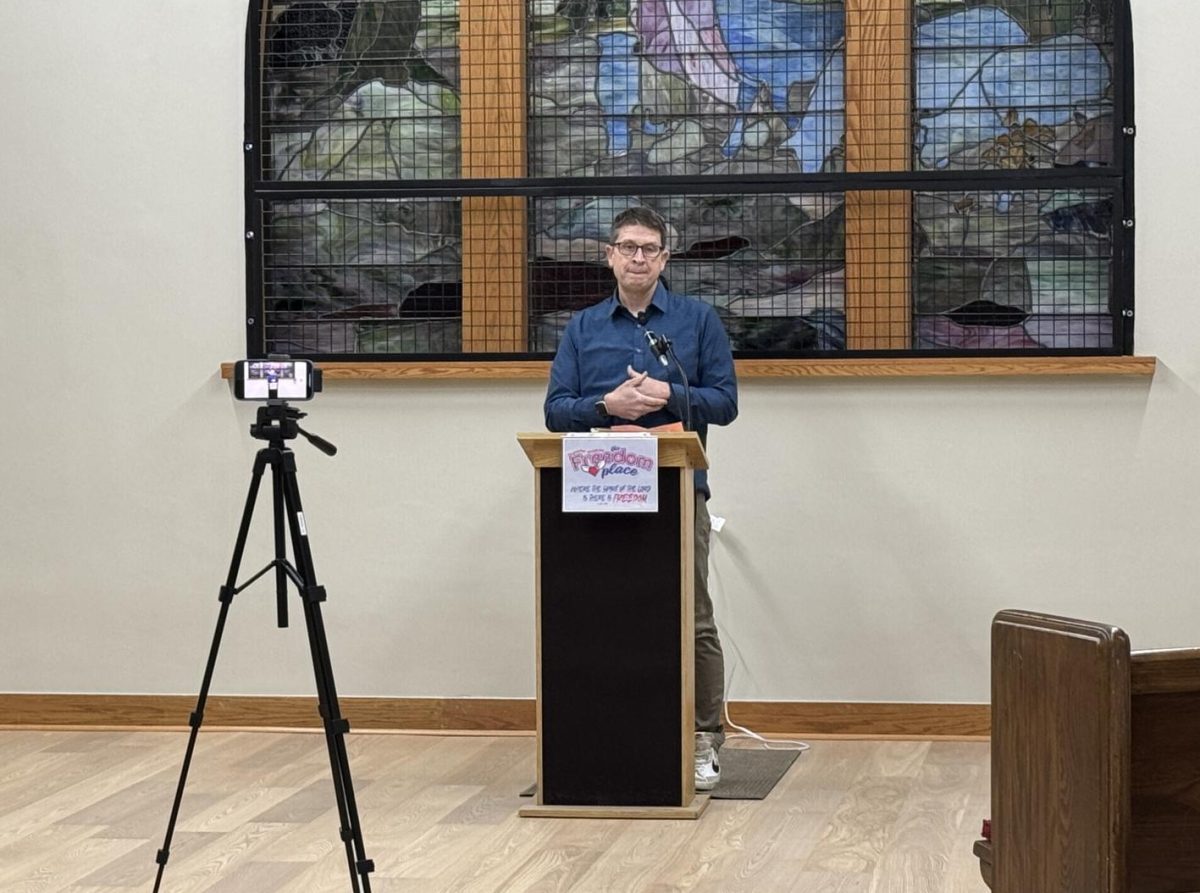 John Mohrbacher speaks to the audience at the opening and dedication of Freedom Place on Saturday, Feb. 15.