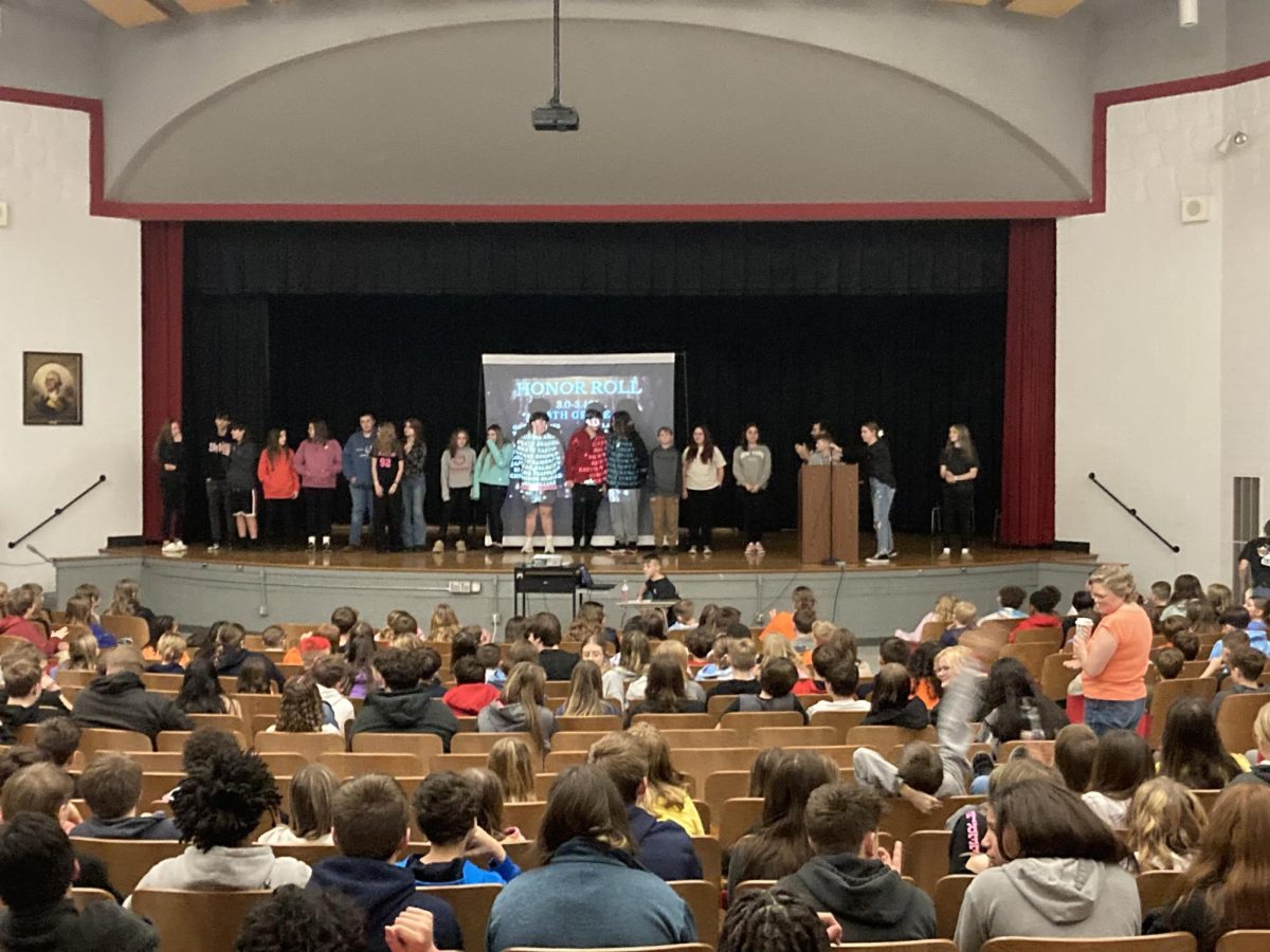 Students stand on stage to be recognized for honor roll during the Celebration of Accomplishments on Friday, Jan. 31. 