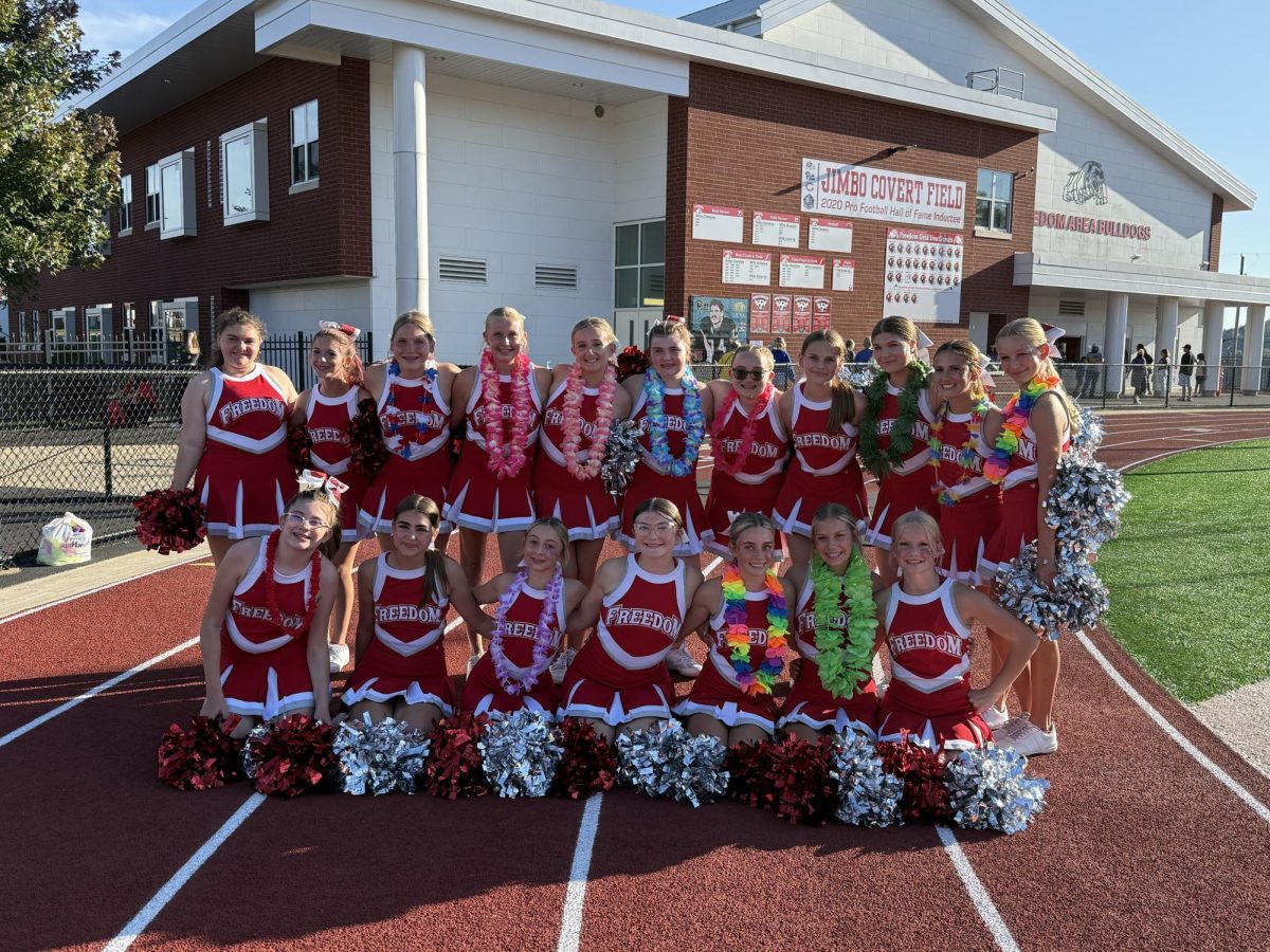 The cheer team takes a picture before their luau game on Sept. 3 against Carlynton at home.