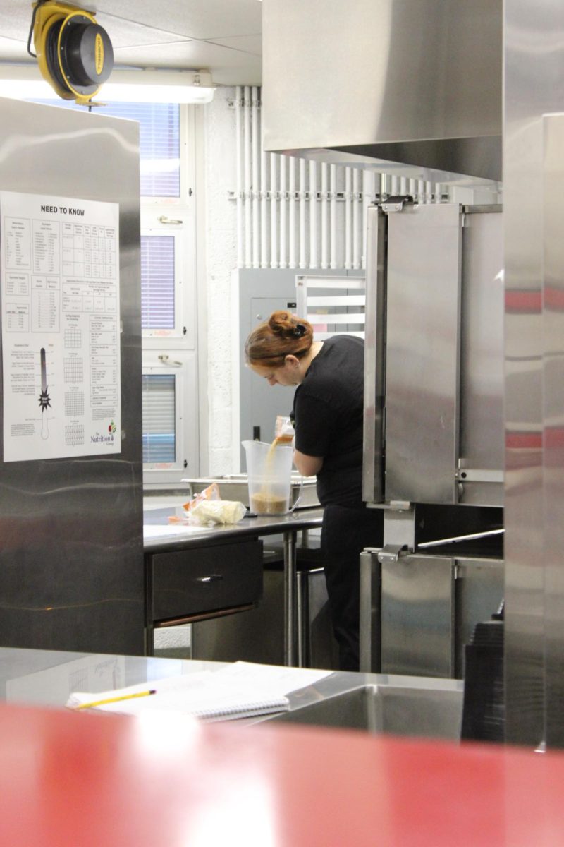 Heather Mosconi makes rice in the middle school cafeteria.