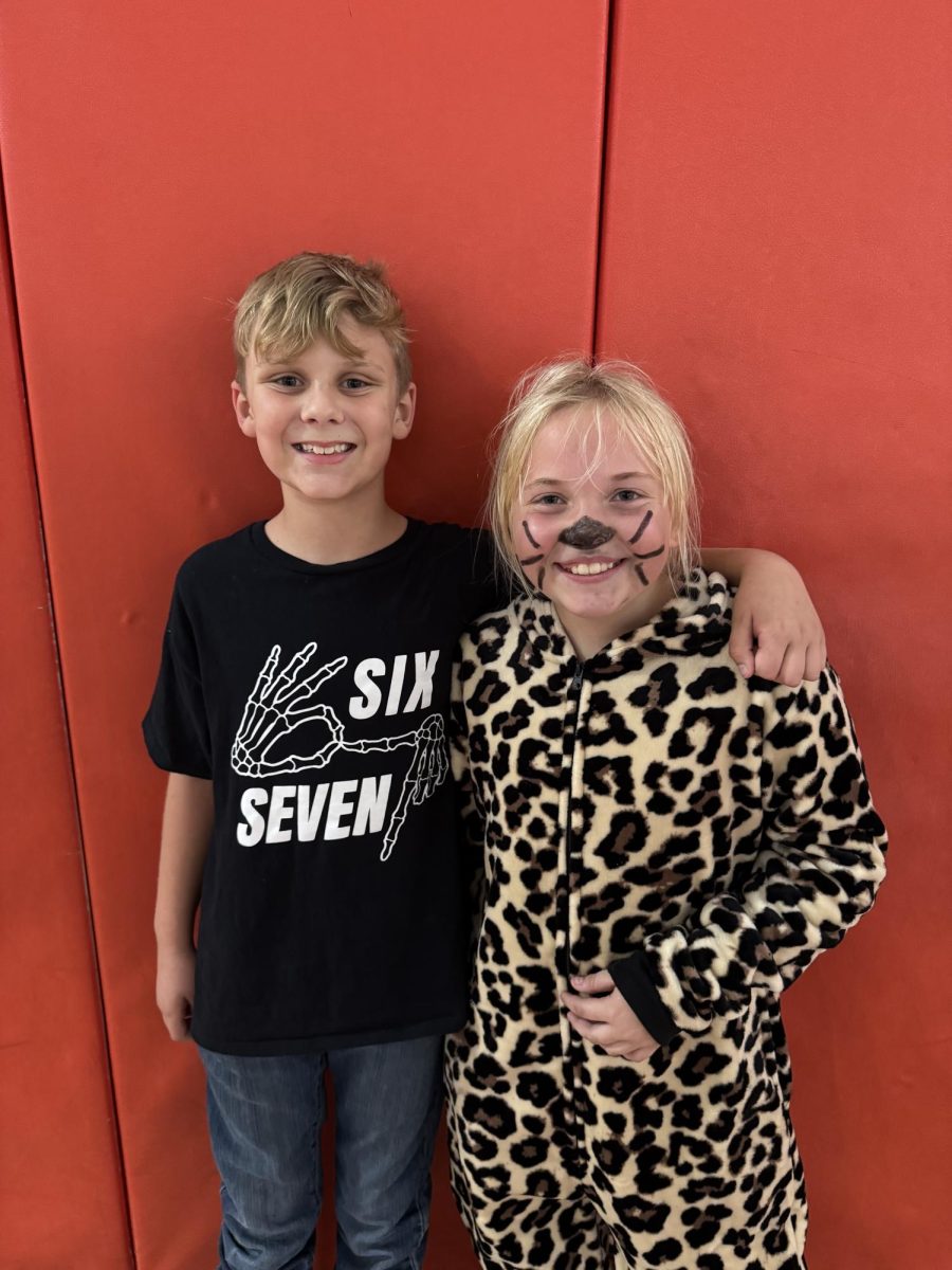 Layla Tyler (5) and Walker Donawitz (5) at the Halloween dance in the gym on Fri, Oct. 24.