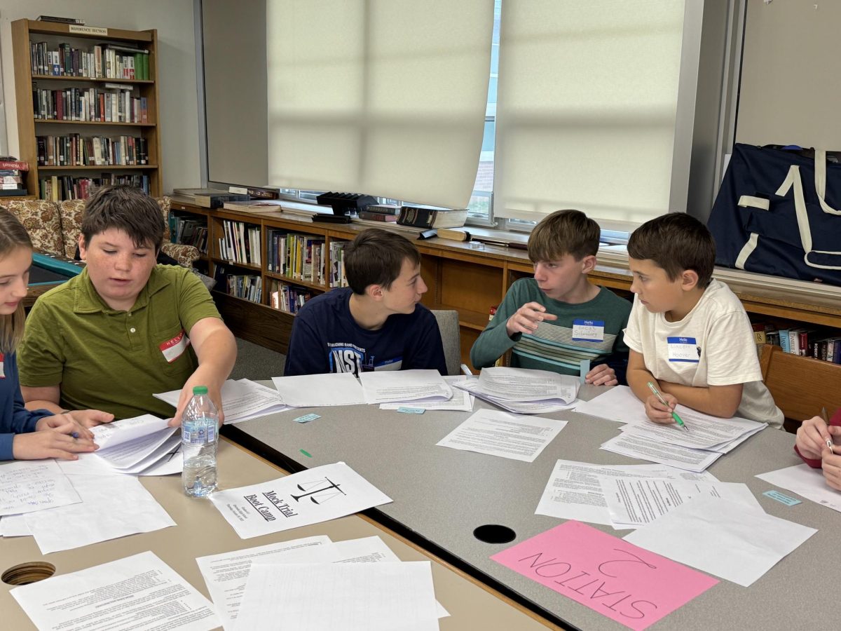 Lucas Miller (7), Lincoln Murphy (8), Lucas Schomburg (7), and Lincoln Hoover (7) prepare the defense’s argument.