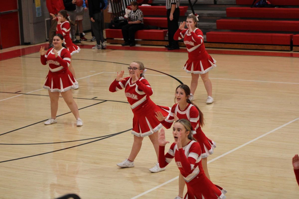 Cheerleaders perform their halftime routine at a home basketball game on Dec. 17, 2025.
