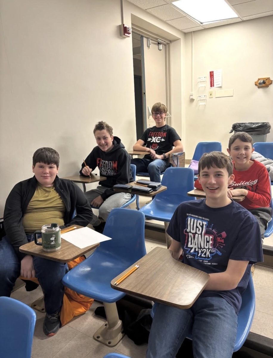 Five Math Counts participants pose for a picture before beginning the competition on Saturday, Feb. 14, at Geneva College.