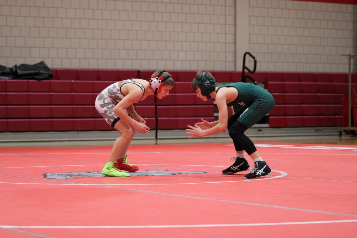 Carter Dambach (8) faces his Laurel opponent as the match starts at Freedom High School.