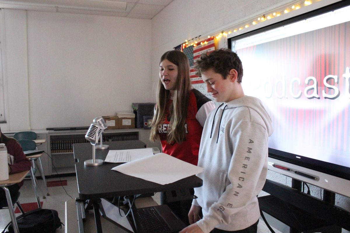 Eli Bruce (8) and Temperance Max (8) present their podcast to the class.
