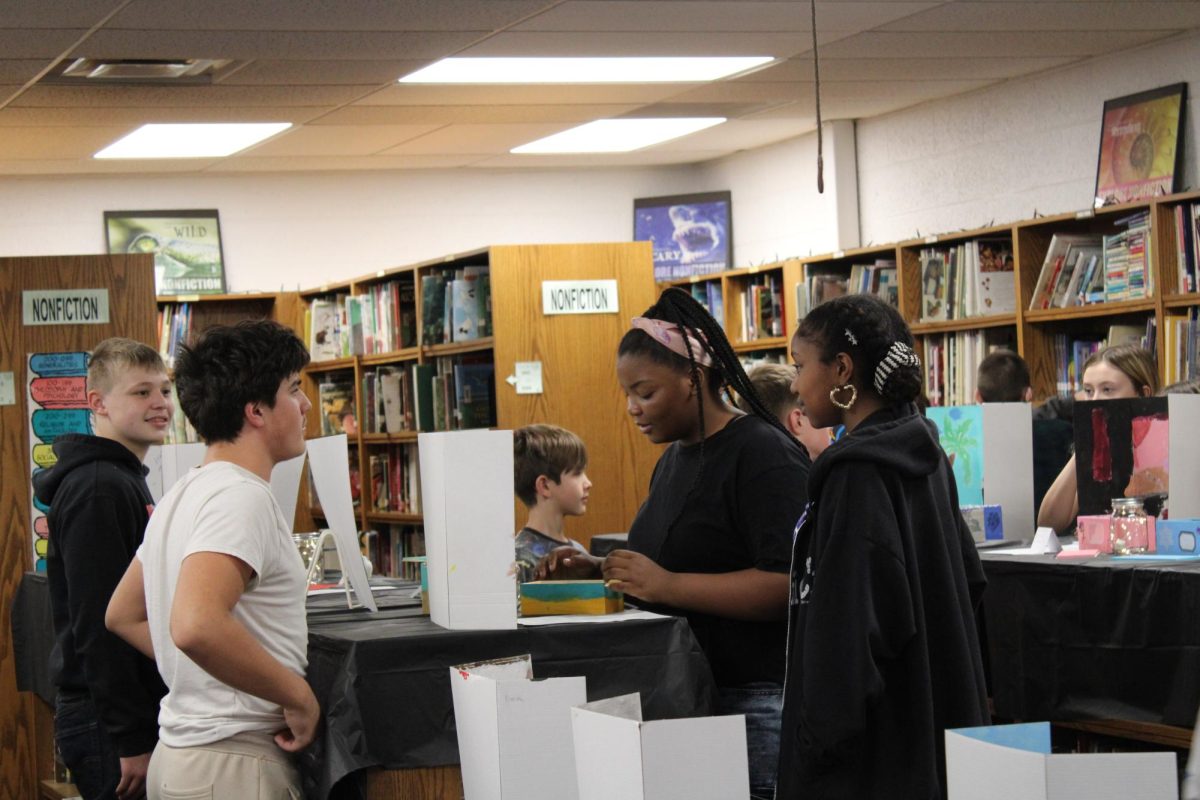Jaxsin Spratley (7) presenting his Gallery Walk Project.