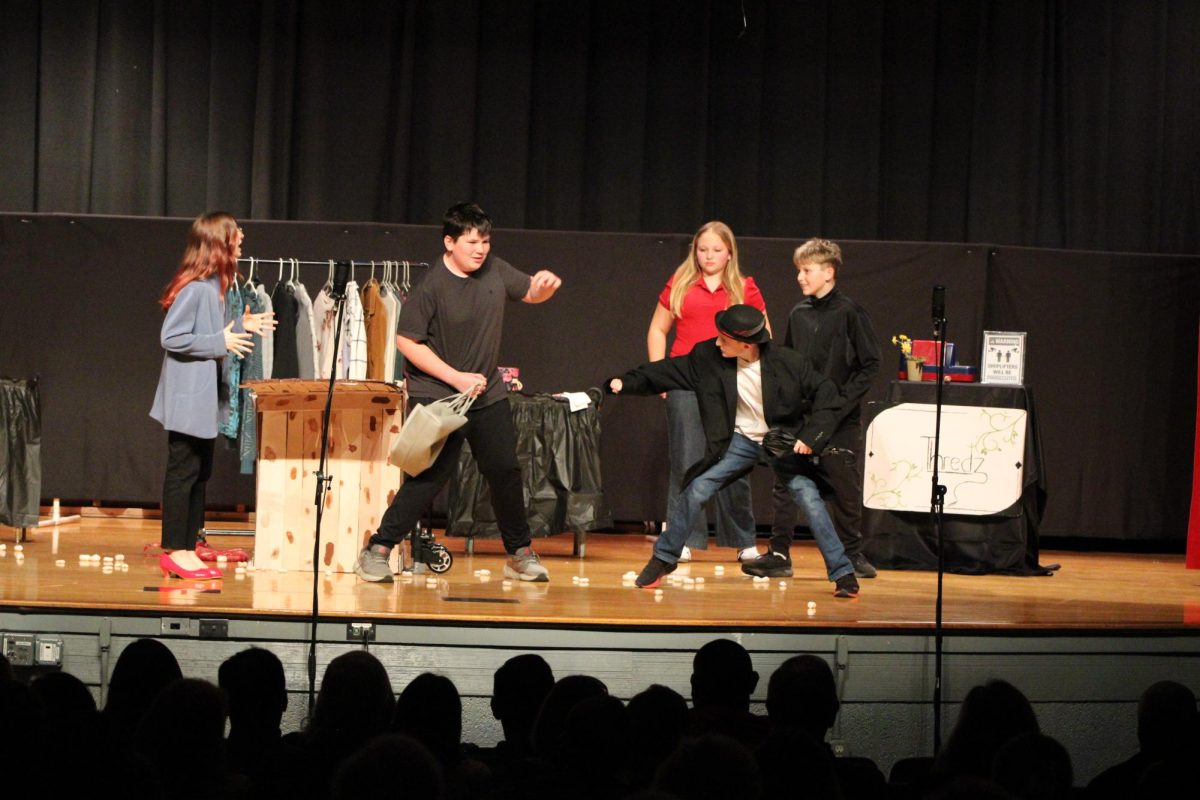 Isaac Mattern (7) and Lucas Miller(7)  fight over stolen money while Lucy Tyler (7) and Jameson McGowan (7) watch.