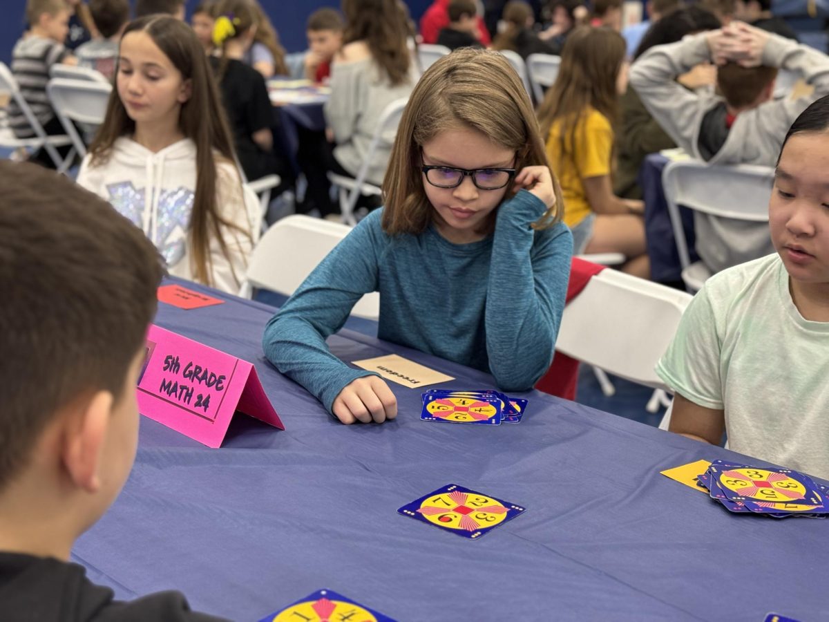 John Rywolt (5) races to solve a Math 24 card while competing at Penn State Beaver on Tuesday, March 10.