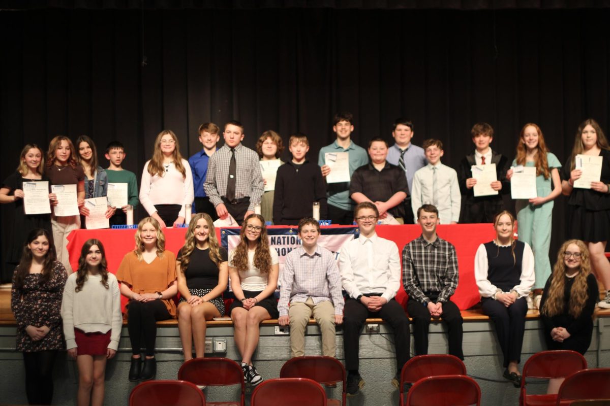 The new and old members pose for their club photo at the NJHS ceremony on March 11.