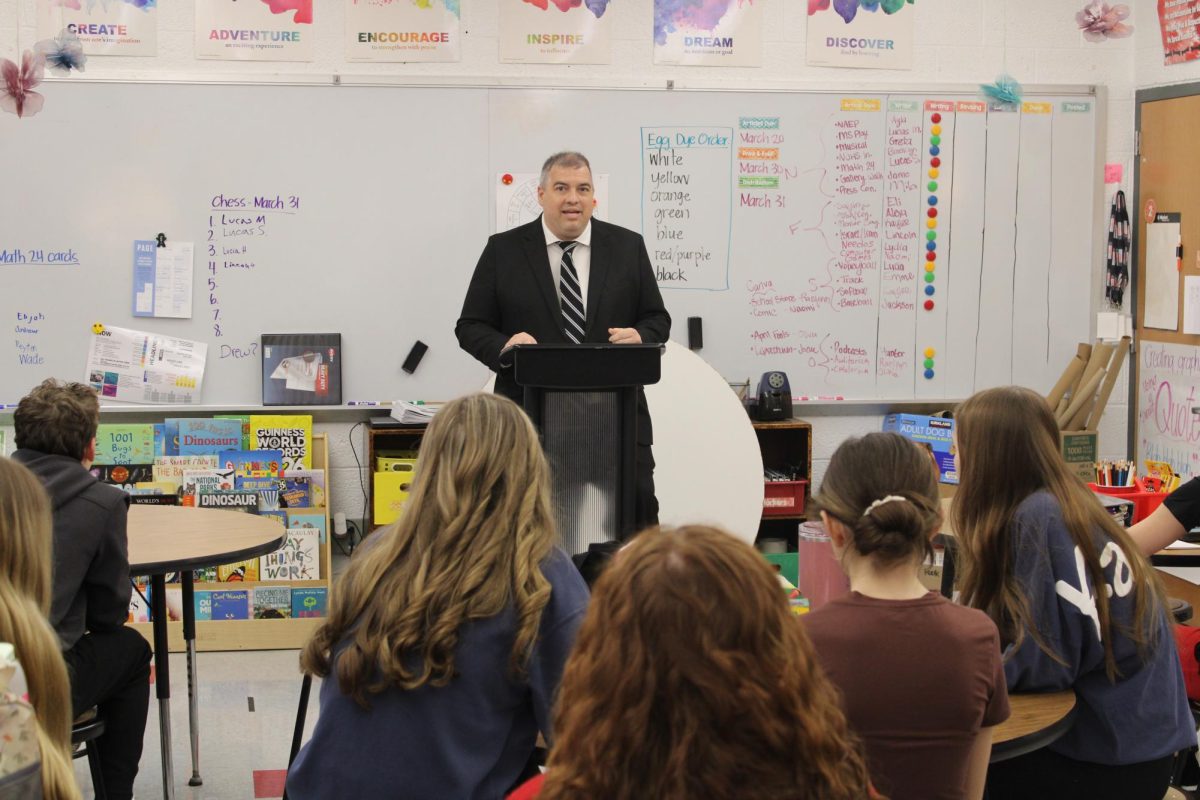 Journalism students listen as Mr. Griffith speaks on the current state of the school.