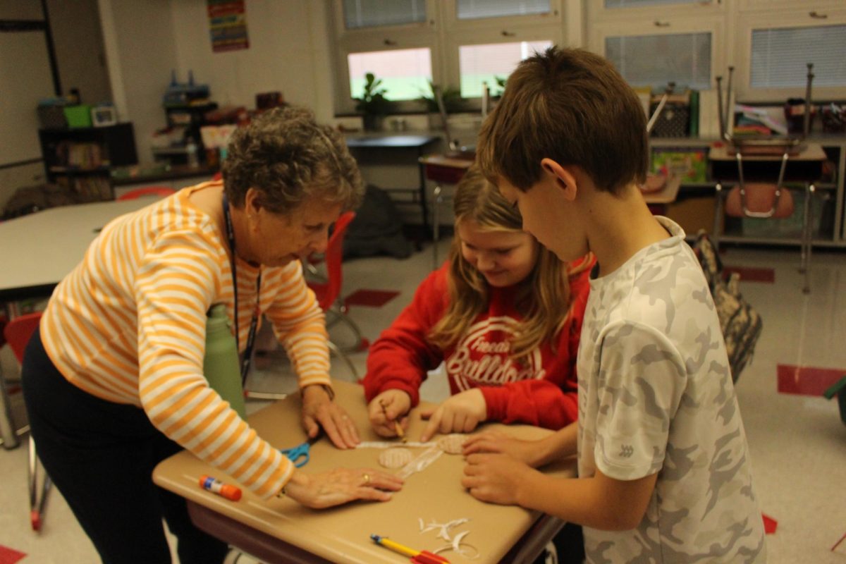 MS. Heiman helping a student out as a substitute in Ms. Glover's room during 9th period.