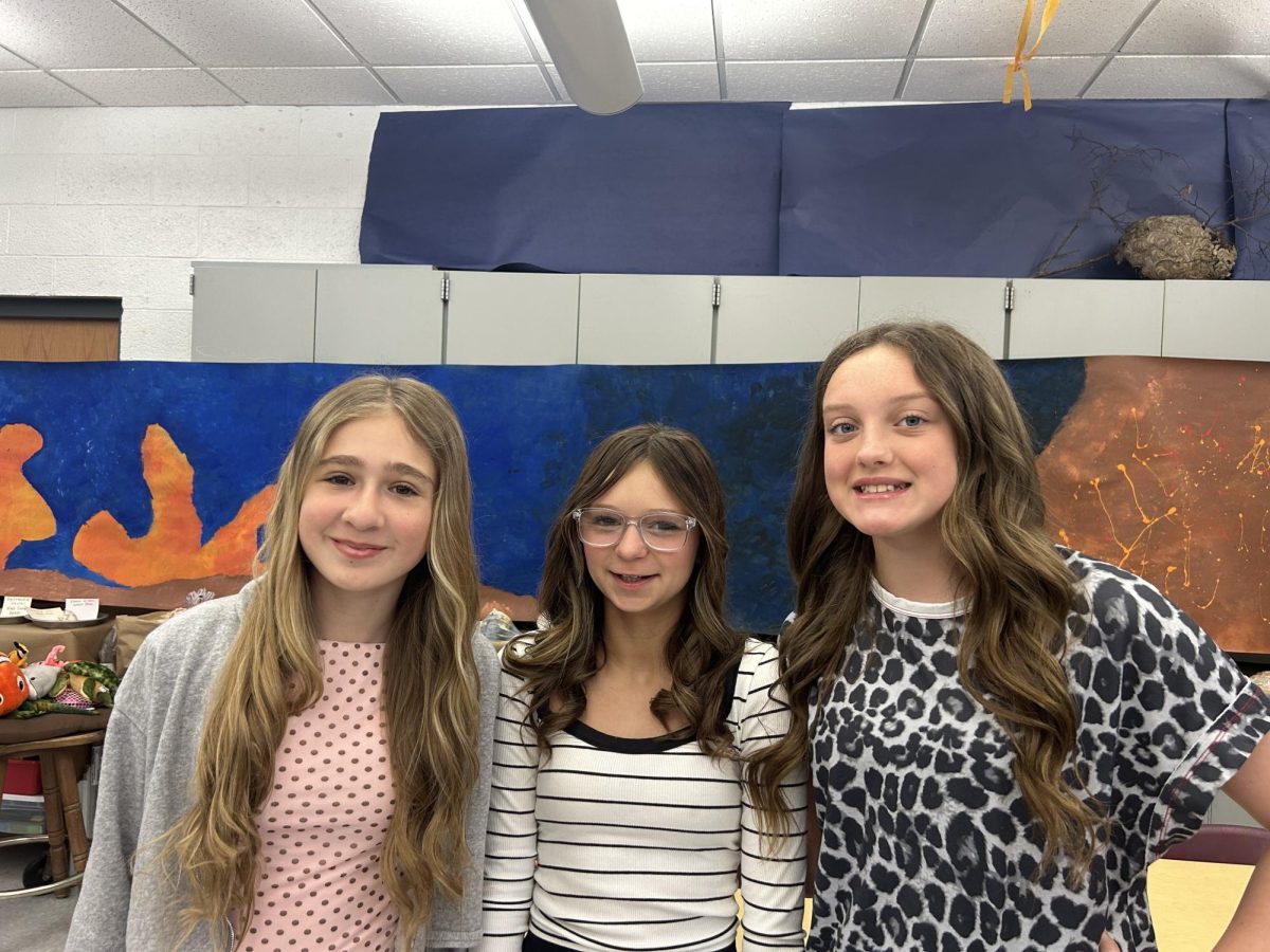 This photo, taken on April 23, 2026, is of students Sara Houy (6), Penelope Stroupe (6), and MacKinley O’Donnell (6) wearing well-presented outfits to school.
