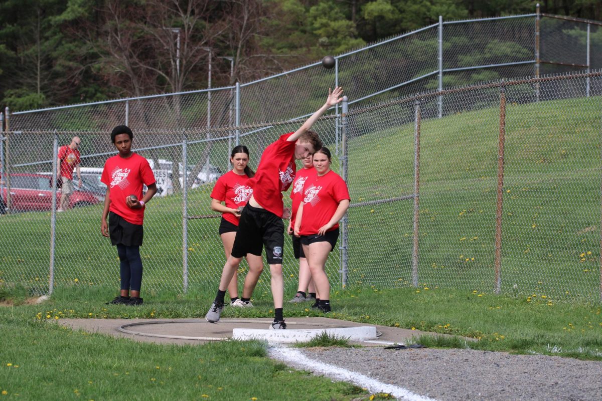 Otto Weir (8) throws his shot put at the New Brighton track meet.