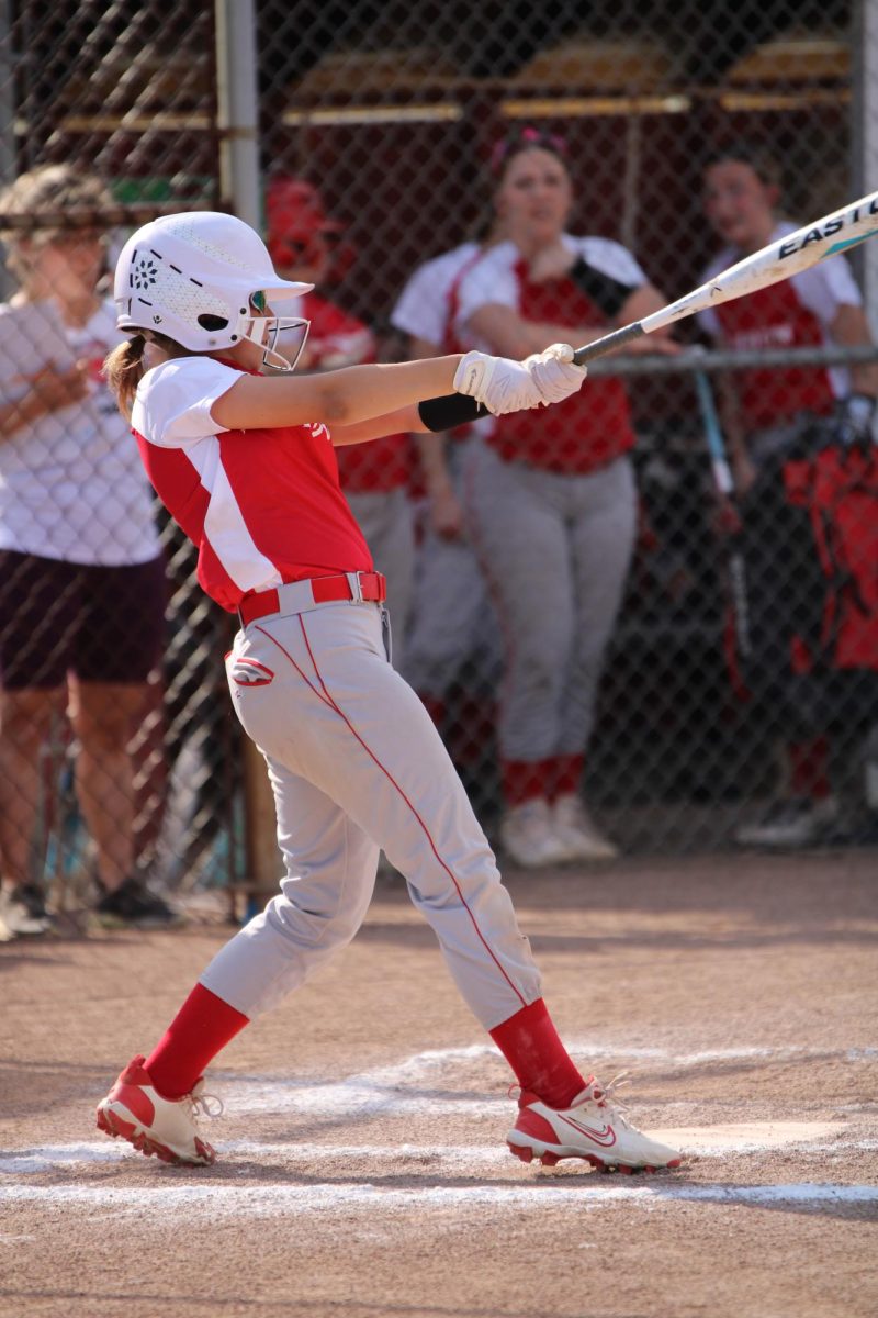 On March 22, against New Brighton, Leah Warner (7) steps into the batter's box and swings her bat at the pitch.